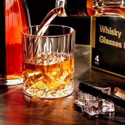 Elegant Crystal Whiskey Glasses Set of 4, lead-free GLASKEY rocks glasses with diamond-cut base, perfect for displaying on a bar cart.