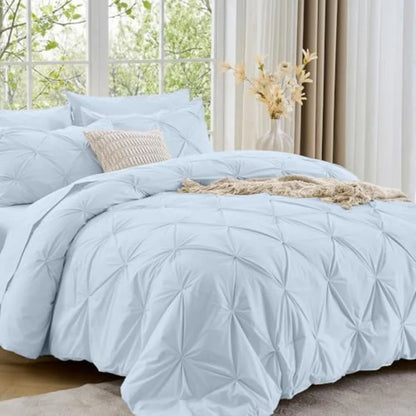 Fall in love with your bedroom again with this stunning Queen 7-Piece Pintuck Comforter Set, made for elegance and functionality.