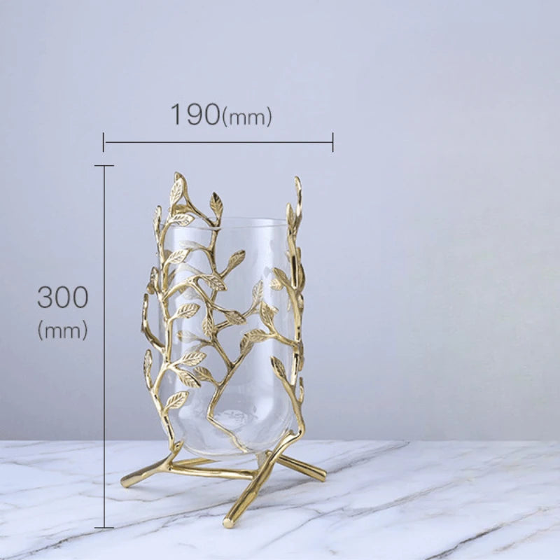 Showcasing the Elegant Clear Glass Vase with Gold Metal Branches that adds a touch of luxury to any interior.