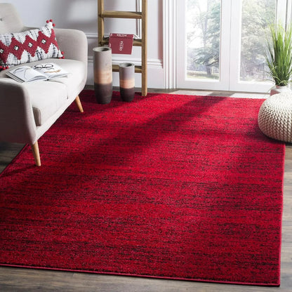 Modern Black & Red 6' x 9' Loomed Area Rug showcasing its abstract design, perfect as a black and red rug for contemporary spaces.