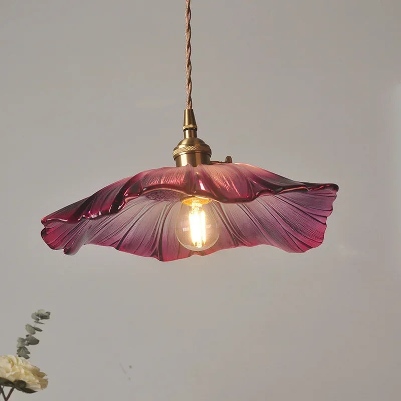 Stunning close-up of the Artisan Lotus Leaf Pendant Light highlighting the handcrafted glass design and warm light options.