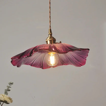 Stunning close-up of the Artisan Lotus Leaf Pendant Light highlighting the handcrafted glass design and warm light options.