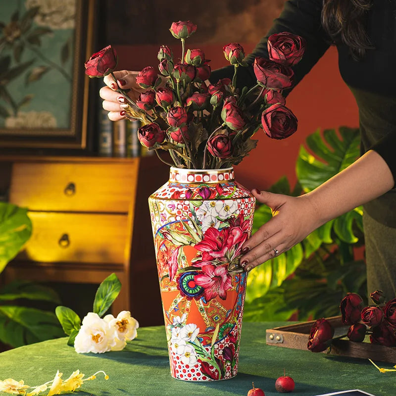 The 13-inch tall Colorful Ceramic Flower Vase with Gold Accents displayed elegantly on a table, ideal for any home decor.