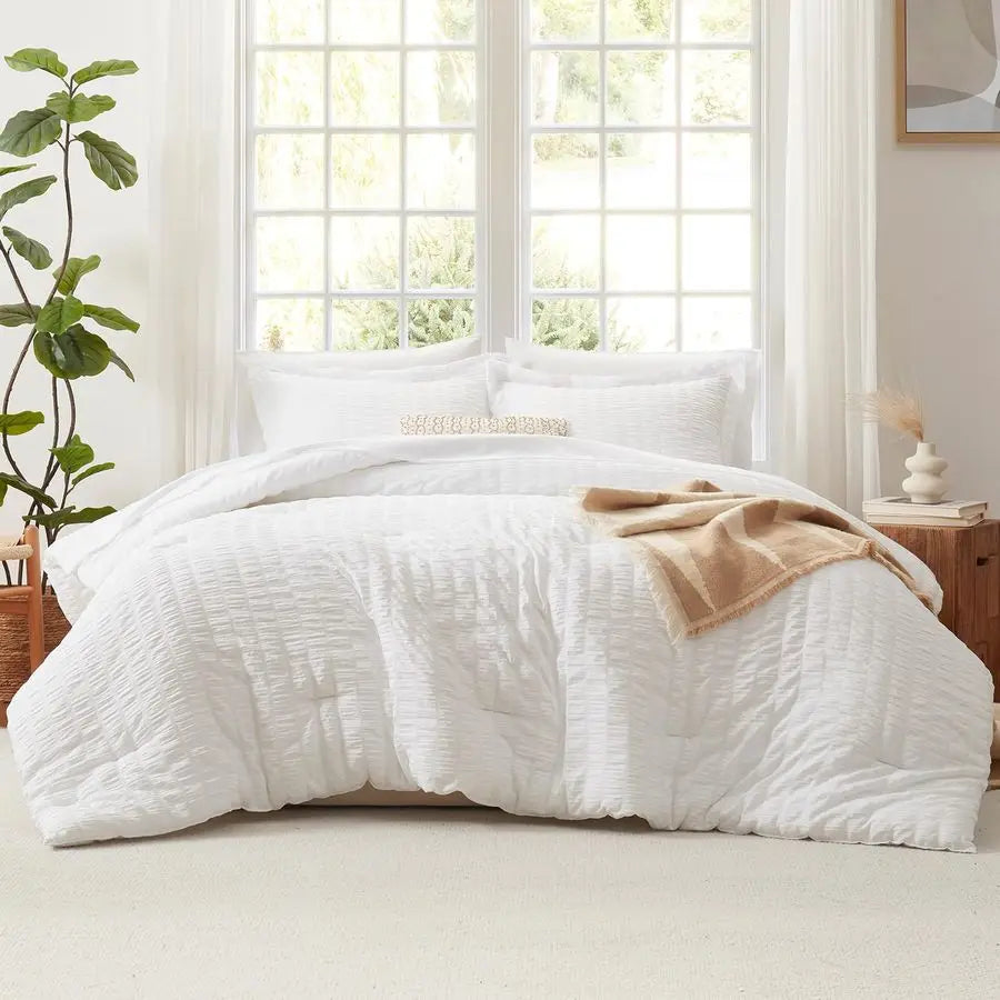 Complete view of the 7-Piece Luxury Queen Bedding Set in Winter White, showcasing the down alternative comforter and stylish pillow shams.