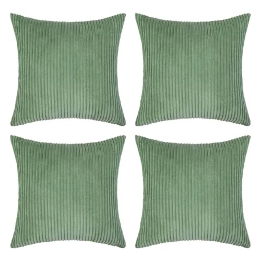Four sage green ribbed corduroy throw pillows arranged in a 2x2 grid on a plain white background.
