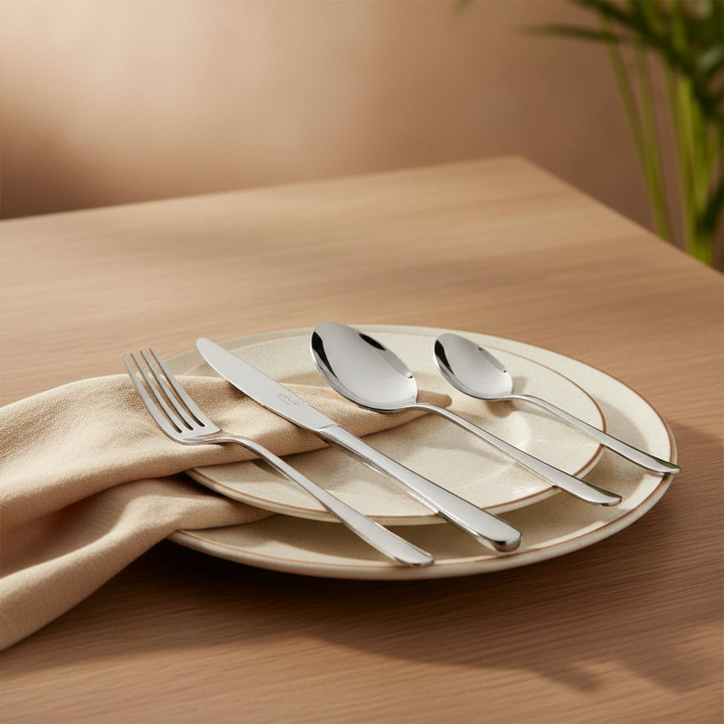 Elegant 18/10 Stainless Steel Flatware Set for 6 displayed on a beautifully set dining table, emphasizing its rust-resistant quality and stylish design as a top choice stainless steel flatware set.