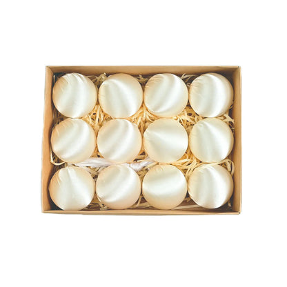 A festive clustering of beautiful satin silk ball ornaments displaying colors like light blue and khaki for a cheerful Christmas vibe.