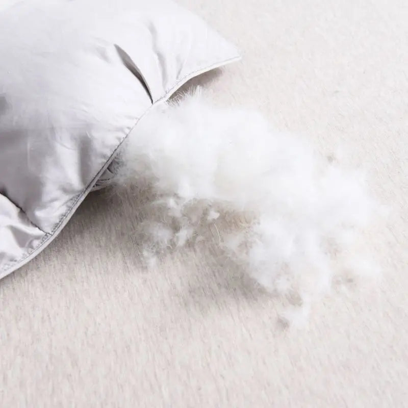 Close-up of the Luxurious White Goose Down Comforter highlighting the plush white goose down filling and breathable cotton.