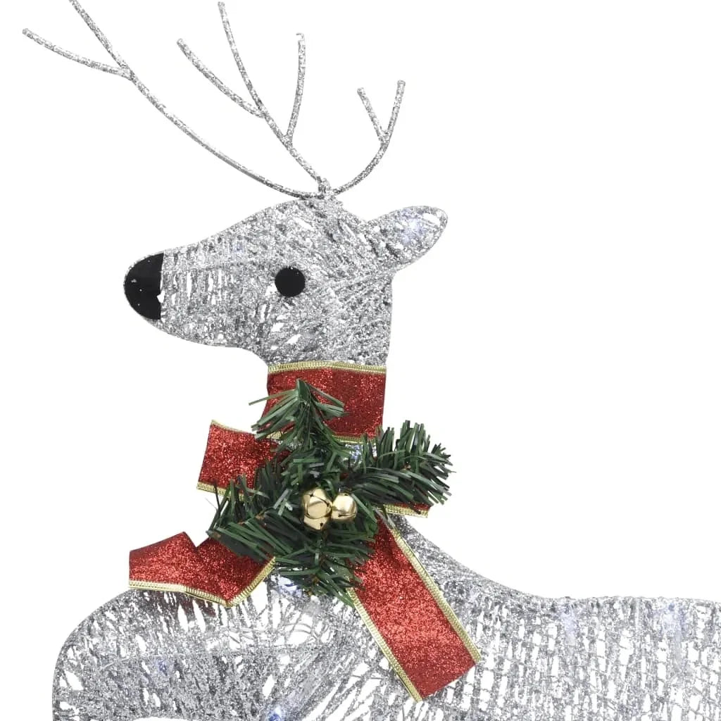 A beautiful display of the Outdoor Silver Reindeer & Sleigh Christmas Decoration w/60 LED Lights set against a snowy backdrop, showcasing the festive silver reindeer decoration.