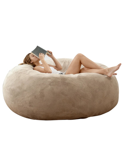 The Oversized Faux Fur Bean Bag Chair featured as stylish seating near a floor lamp and side table, creating a modern, laid-back vibe in any room as an oversized bean bag chair.