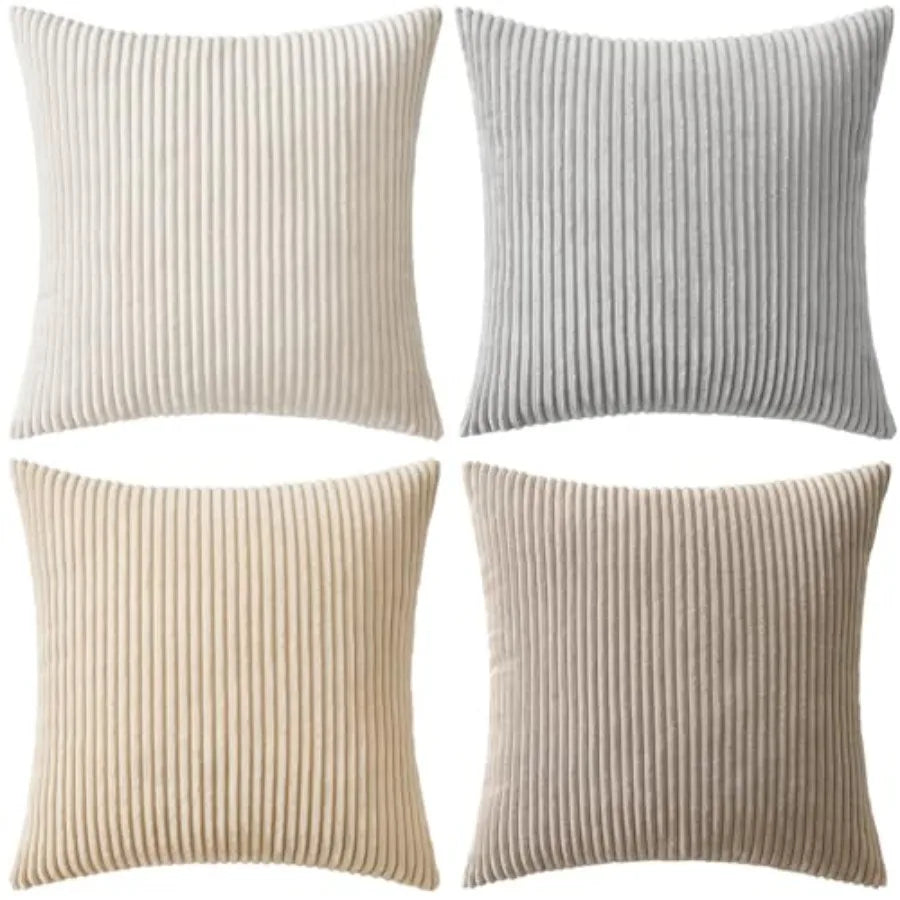 Four ribbed texture throw pillows in beige, gray, and brown on a white background