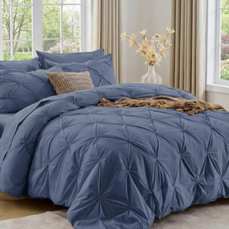 This stylish Queen 7-Piece Pintuck Comforter Set is complete with all essential bedding items, ensuring an effortless setup for your bed.