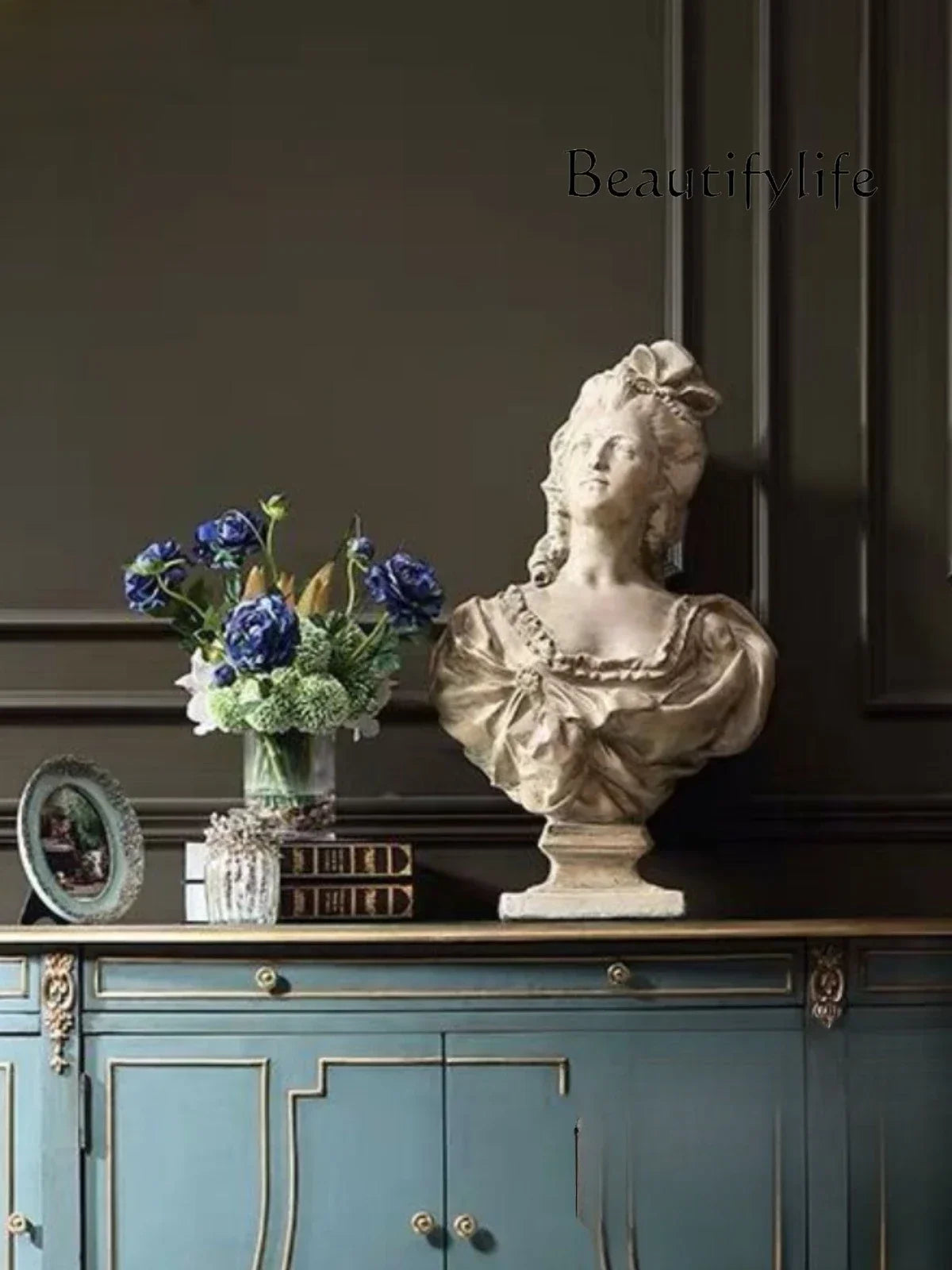 Elegant Blue & Gold French-American Style Sideboard Cabinet styled with decorative items; a fashionable blue and gold sideboard perfect for showcasing your decor.