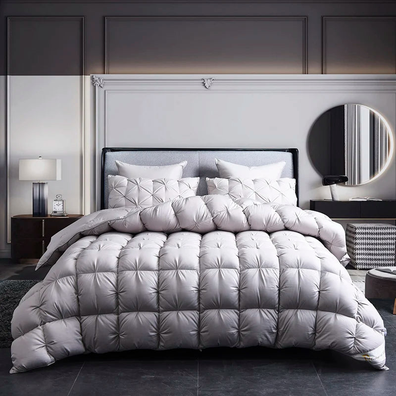 Multiple sizes of the Luxurious White Goose Down Comforter displayed together for easy selection.