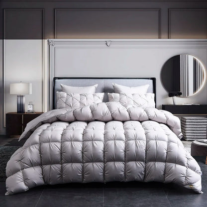 Multiple sizes of the Luxurious White Goose Down Comforter displayed together for easy selection.