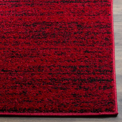 Modern Black & Red 6' x 9' Loomed Area Rug displayed in a bright setting, showcasing its non-shedding characteristics as a durable black and red rug.