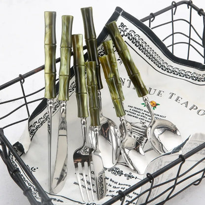 Flatware Set 18/10 Stainless Steel with Bamboo-Style Green Acrylic Handles – 5 Piece Bamboo Elite Cutlery displayed on a dining table, offering a modern twist to traditional stainless steel cutlery.
