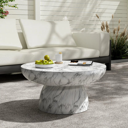 Close-up of the grey veining on the Patsy Luxe Faux Marble Pedestal Coffee Table, emphasizing the quality of this faux marble table in a contemporary setting.