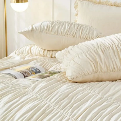 The Ruched Comforter Set shown in a serene bedroom setting, highlighting the luxurious farmhouse comforter softness and elegance.
