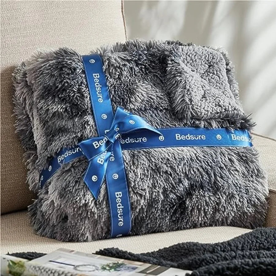 A relaxing scene with the 50x60 Grey Faux Fur Sherpa Throw Blanket, Plush Reversible adding warmth and luxury.