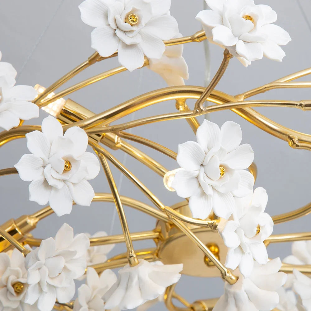 Elegant Gold Luxury Crystal Chandelier showcased above a plush sofa, demonstrating its role as a stunning gold crystal chandelier in contemporary design.