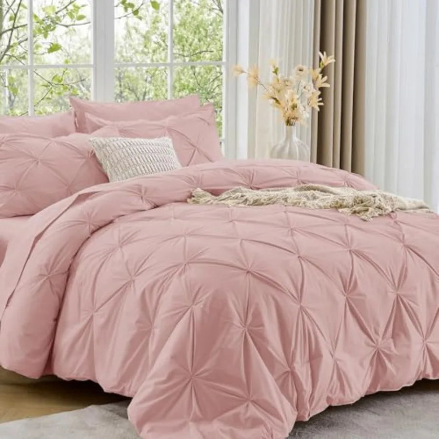 Upgrade your sleep environment with the Queen 7-Piece Pintuck Comforter Set, designed for optimum comfort and modern aesthetics.
