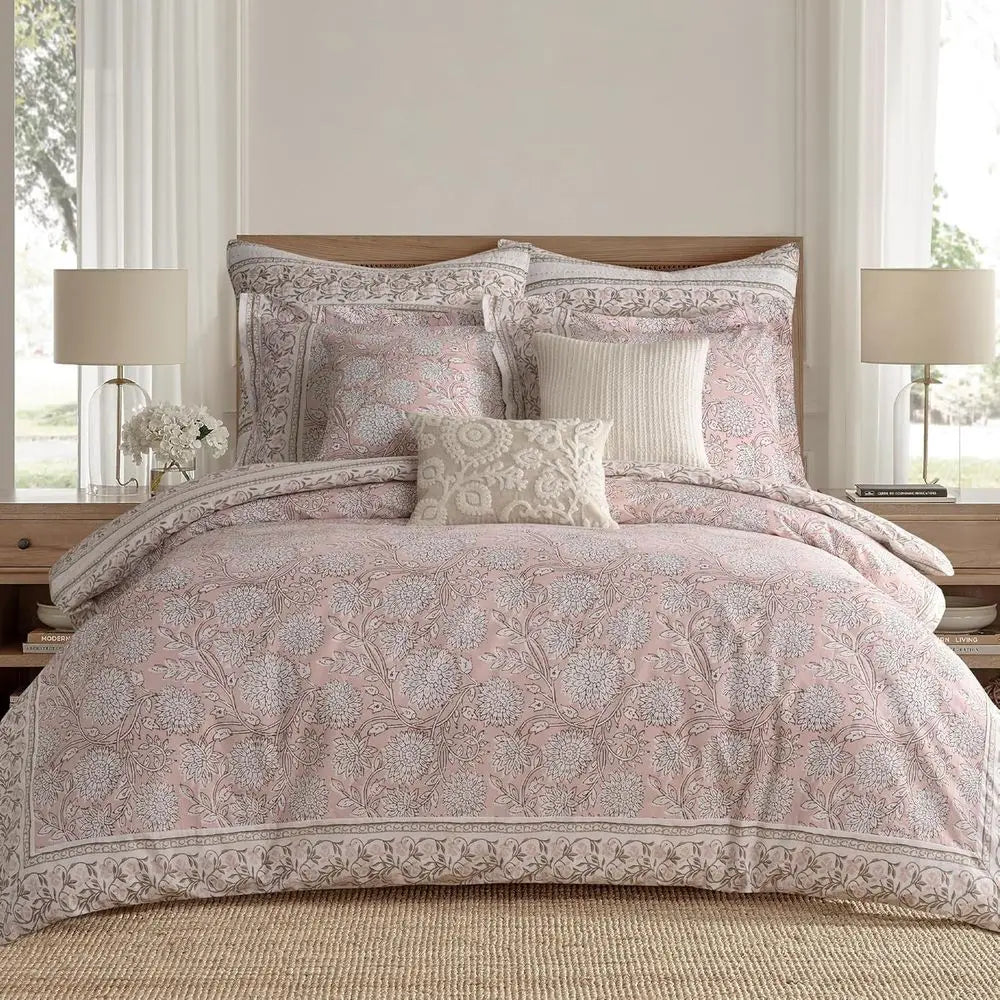 Cozy queen size cotton reversible comforter set in blush and white, includes two matching pillow shams.
