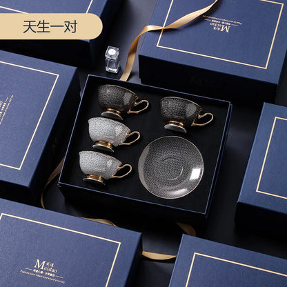 Elegant cups and saucers from the Luxurious European Bone China Coffee & Tea Set displayed on a stylish table setting, perfect for afternoon tea.