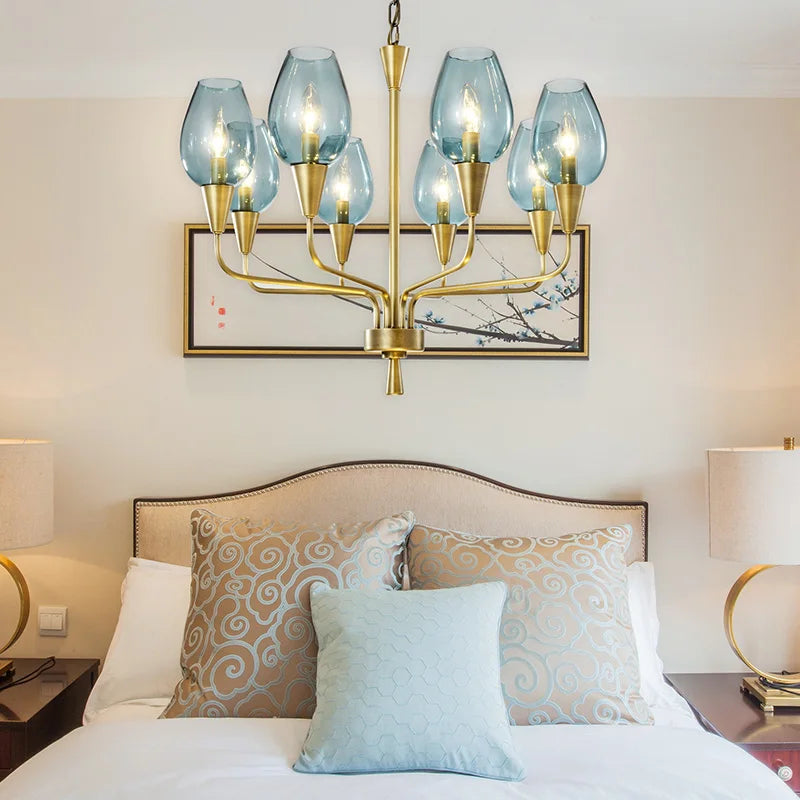 Interior view of the Stunning Modern LED Chandelier in Blue and Matte Brass, demonstrating its unique design and light settings in a stylish living room.