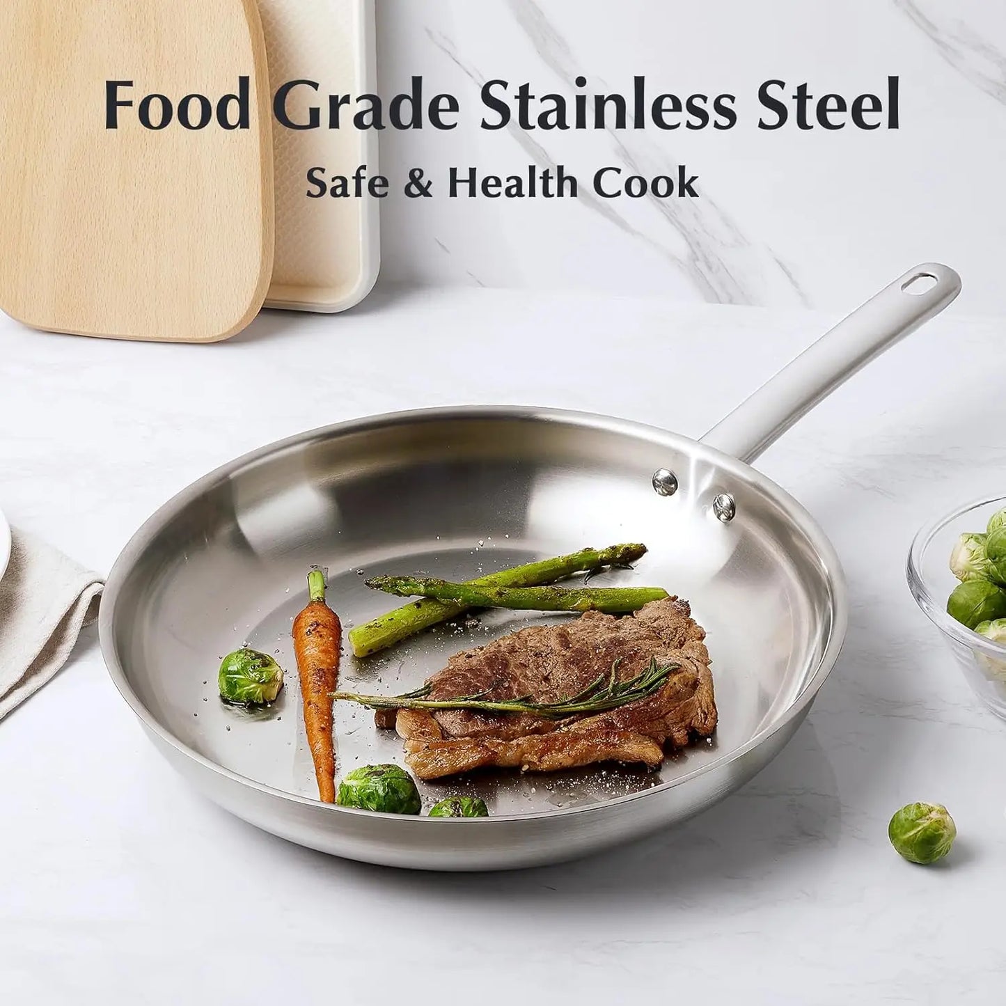 Stainless steel frying pan with food on a white surface, featuring text about food grade stainless steel.