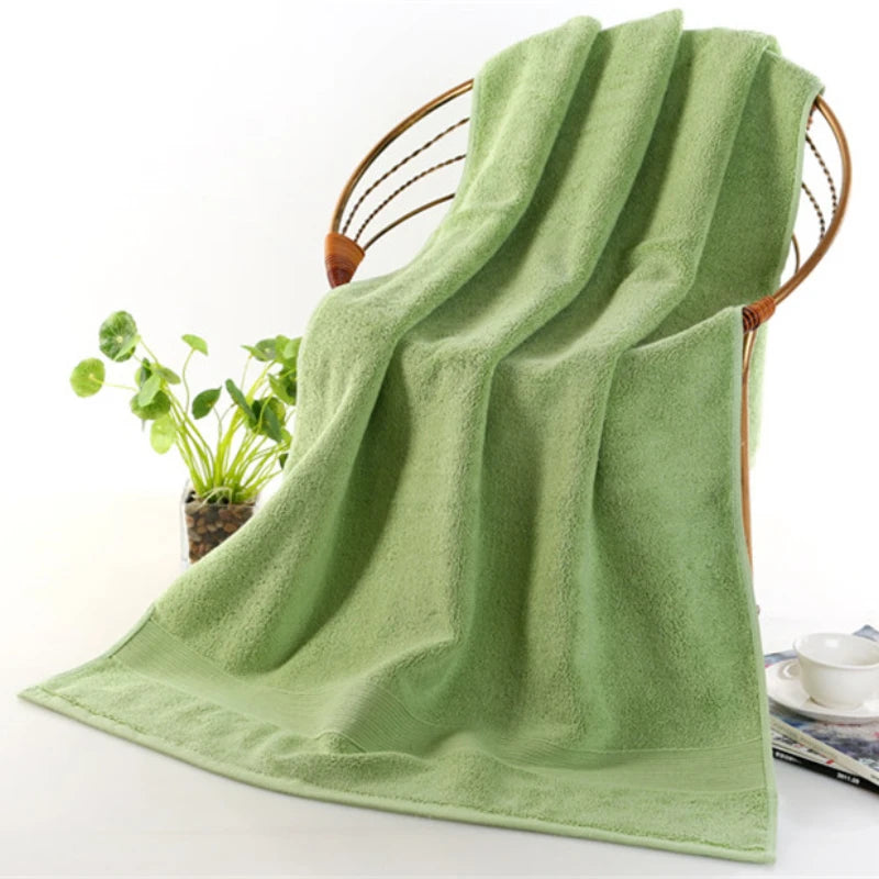 Person wrapping themselves in the Ultra-Soft High-Absorbency Terry Bath Towel after a bath, showcasing luxury and comfort of high absorbency bath towels.