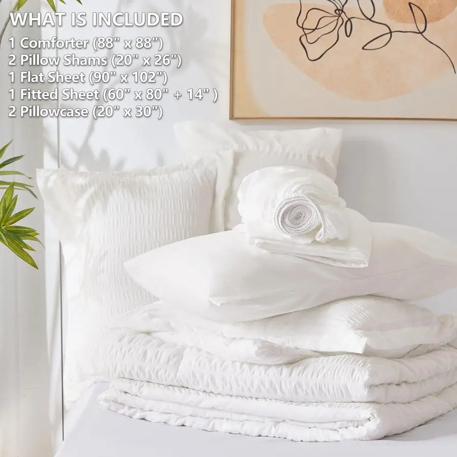 The full 7-Piece Luxury Queen Bedding Set in Winter White, highlighting the plush down alternative comforter and bedding accessories.