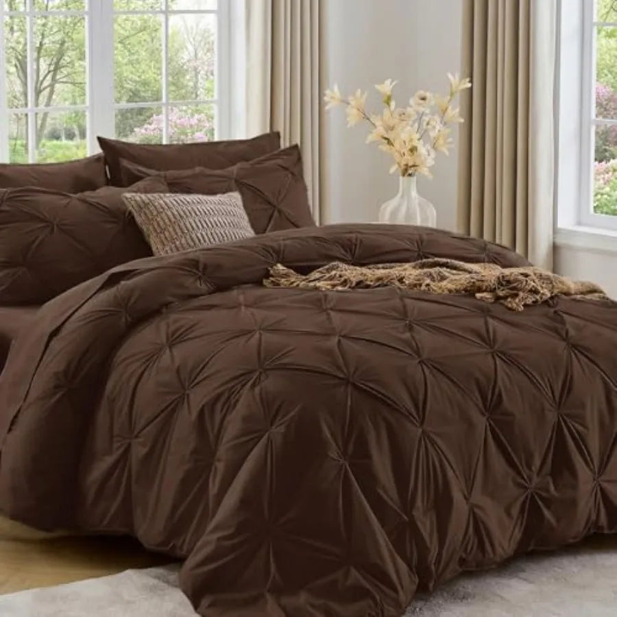 With its elegant design and soft construction, our Queen 7-Piece Pintuck Comforter Set is the perfect upgrade for any modern bedroom.