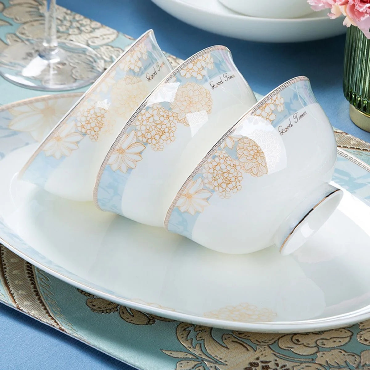 Elegant 16-Piece Blue And White Ceramic Dinnerware Set displayed beautifully with delicious food.