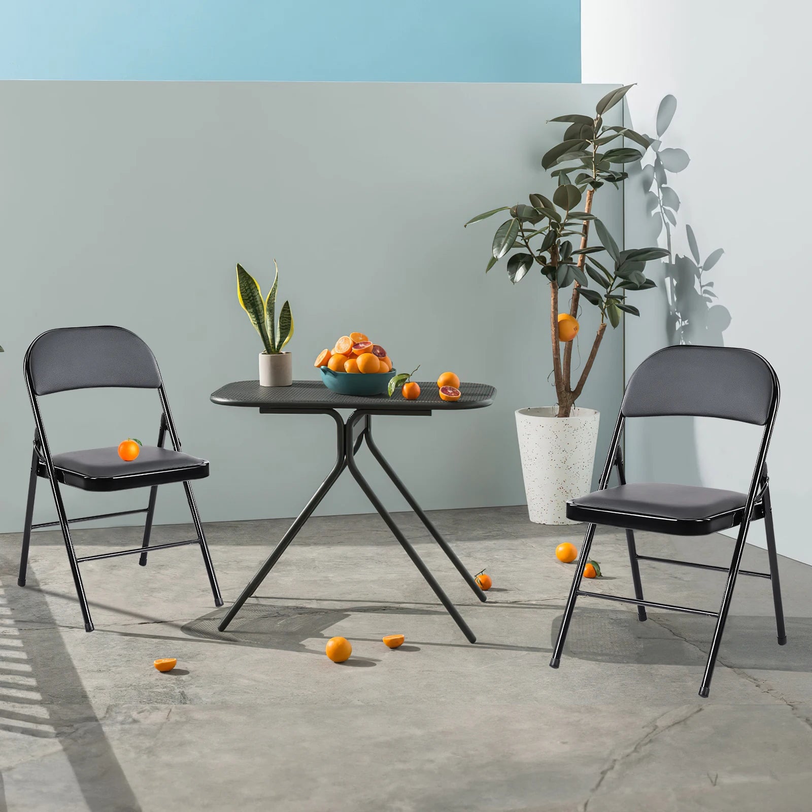Heavy Duty PU Leather Padded Folding Chairs, demonstrating their space-saving folding feature for easy storage.