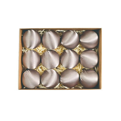 Close-up of soft-touch satin silk ball ornaments in different patterns, adding a charming touch to your Christmas decorations.