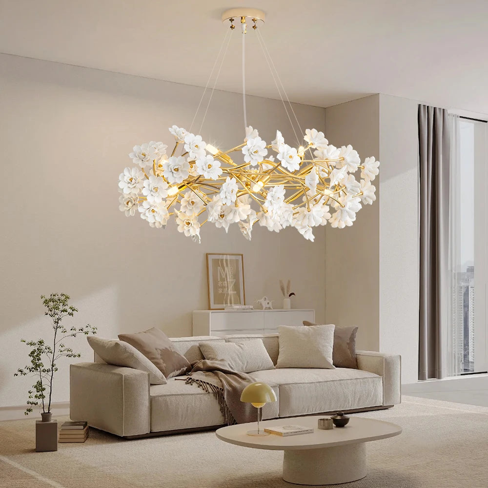 Close-up of the Elegant Gold Luxury Crystal Chandelier highlighting the white flower design and glossy gold finish, an exquisite gold crystal chandelier for stylish spaces.