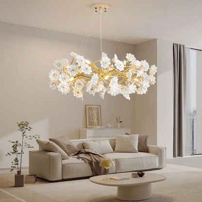 Close-up of the Elegant Gold Luxury Crystal Chandelier highlighting the white flower design and glossy gold finish, an exquisite gold crystal chandelier for stylish spaces.