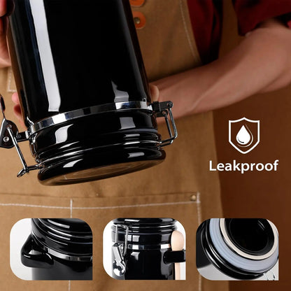 The sleek and modern Luxury Black Ceramic Canister Set with Airtight Seal & Wooden Spoons with chalk labels.