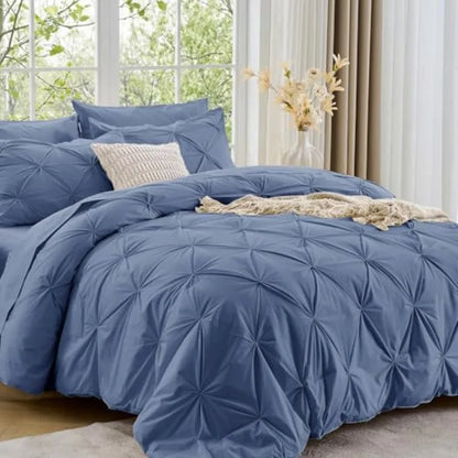The Queen 7-Piece Pintuck Comforter Set offers a polished look for your bedroom, designed to ensure comfort and luxury for sleeping.