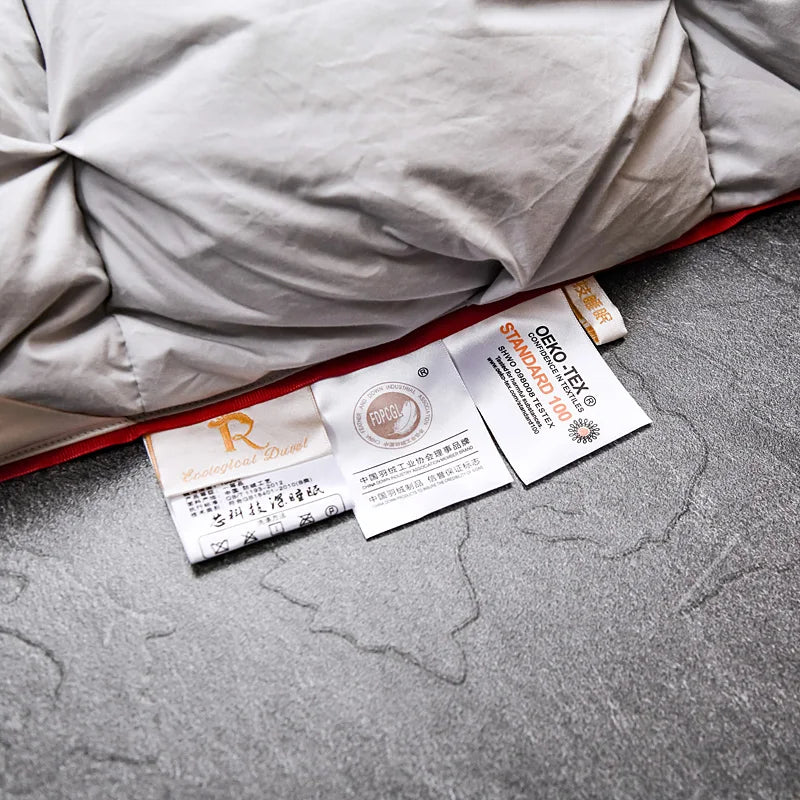 Luxurious White Goose Down Comforter in Grey color, perfect for enhancing bedroom decor.