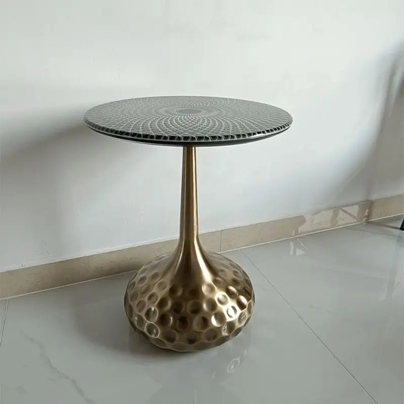 Artisan top accent tables arranged in an entryway, serving as decorative pedestals for plants and accessories.