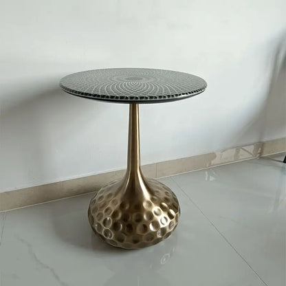 Artisan top accent tables arranged in an entryway, serving as decorative pedestals for plants and accessories.