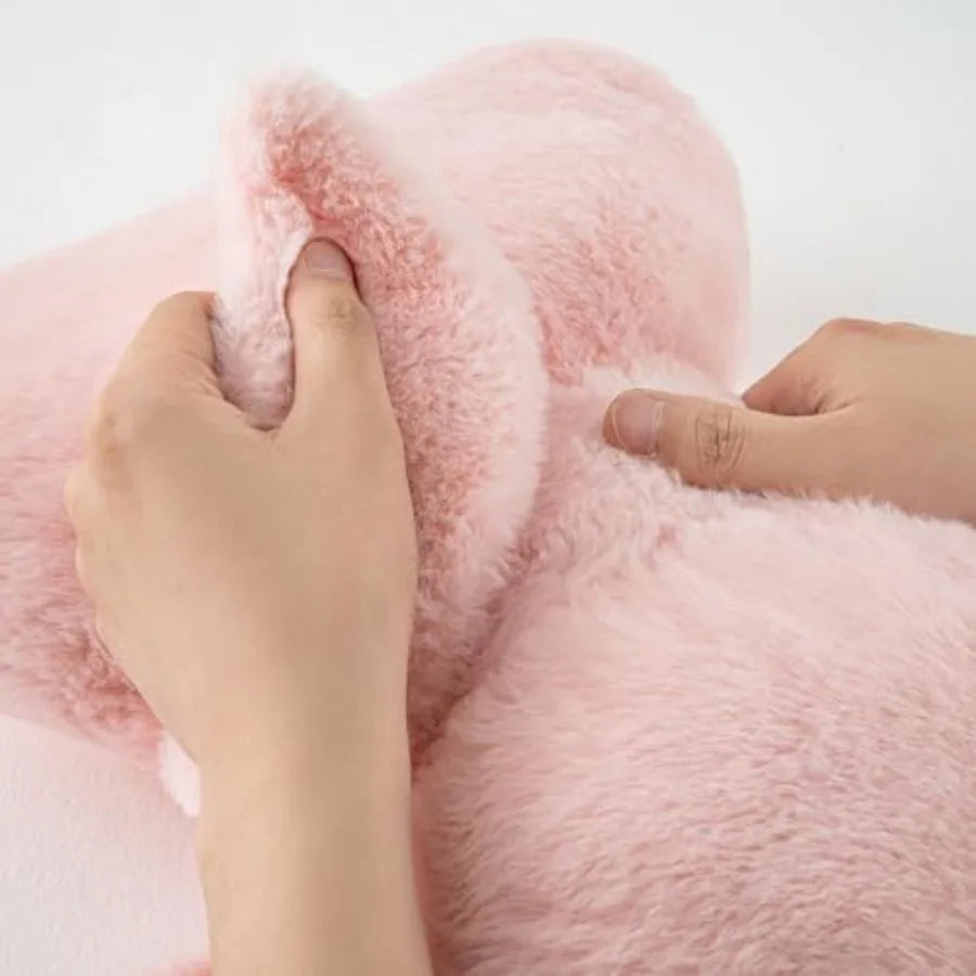 Pink Bow Throw Pillow paired with neutral bedding, showcasing its stylish appeal for cozy home decor.
