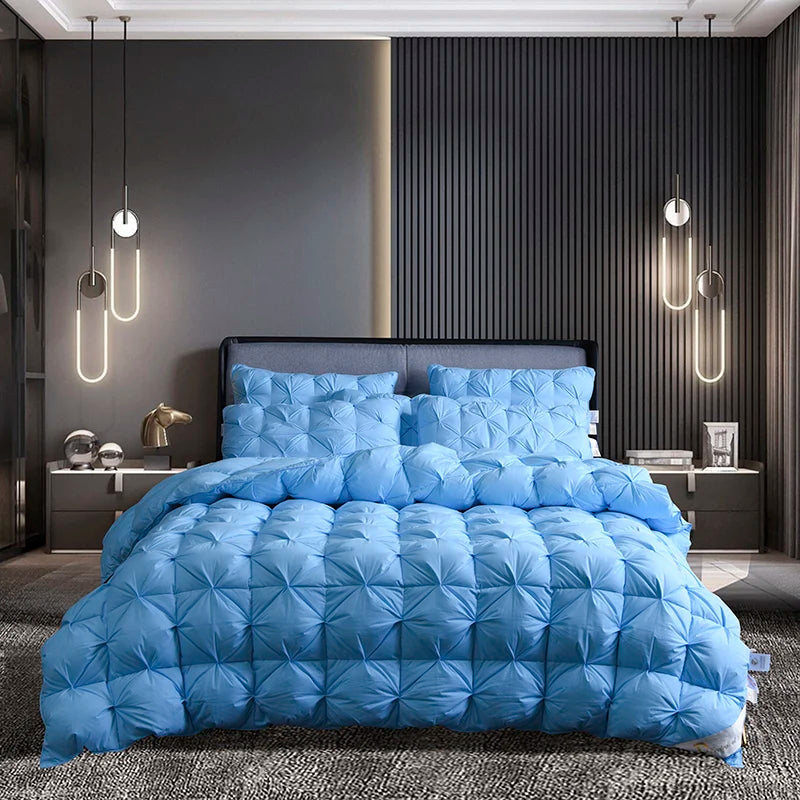 Warm and cozy Luxurious White Goose Down Comforter draped over a plush bed with soft pillows.