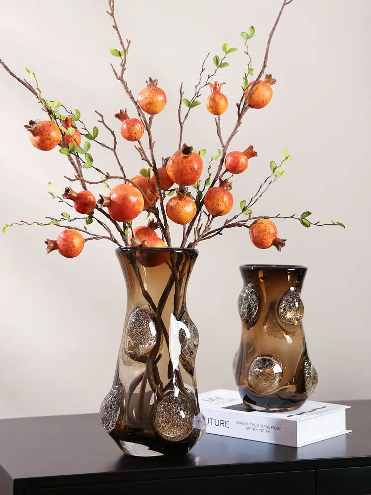 Decorative setup featuring the Coffee Art Glass Nordic Vase on a TV cabinet, emphasizing its modern glass vase characteristics.