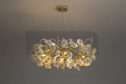 Elegant Gold Luxury Crystal Chandelier in a beautifully decorated entryway, perfect example of a decorative gold crystal chandelier.