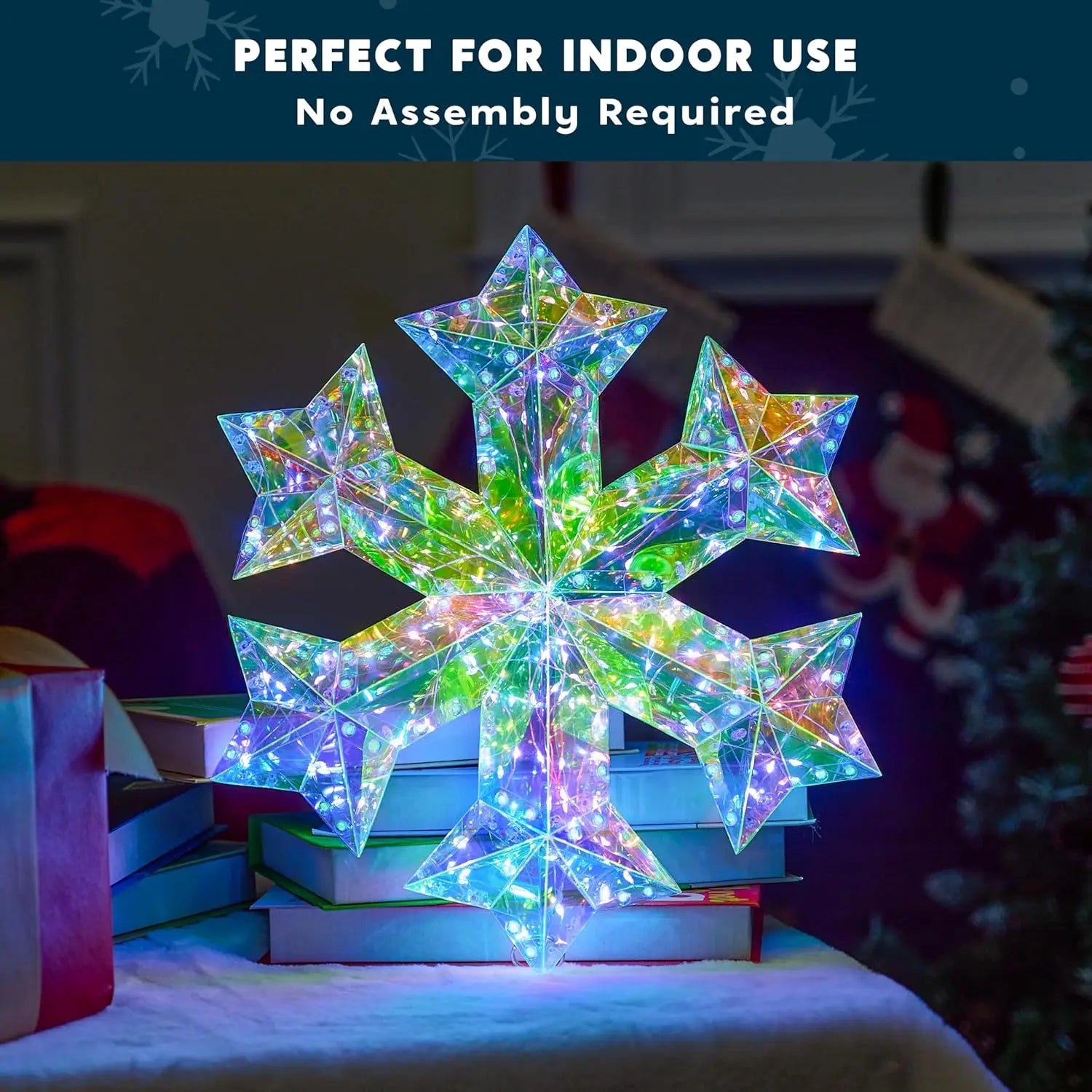 Unique 3D Iridescent Snowflake Ornament with 100 LED Cool White Lights - Perfect for indoor use, showcasing a 3D snowflake ornament sitting elegantly on a stack of books.