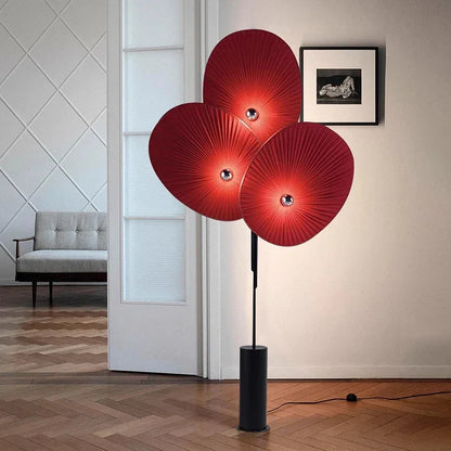 Elegant Modern Triple Floral Floor Lamp with LED Light placed beside a sofa.