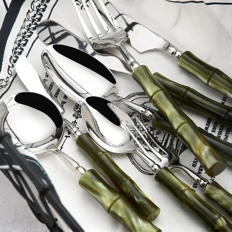 Close-up of Flatware Set showing the durable 18/10 stainless steel cutlery and bamboo-style green acrylic handles, ideal for adding a luxurious touch to your dining experience.